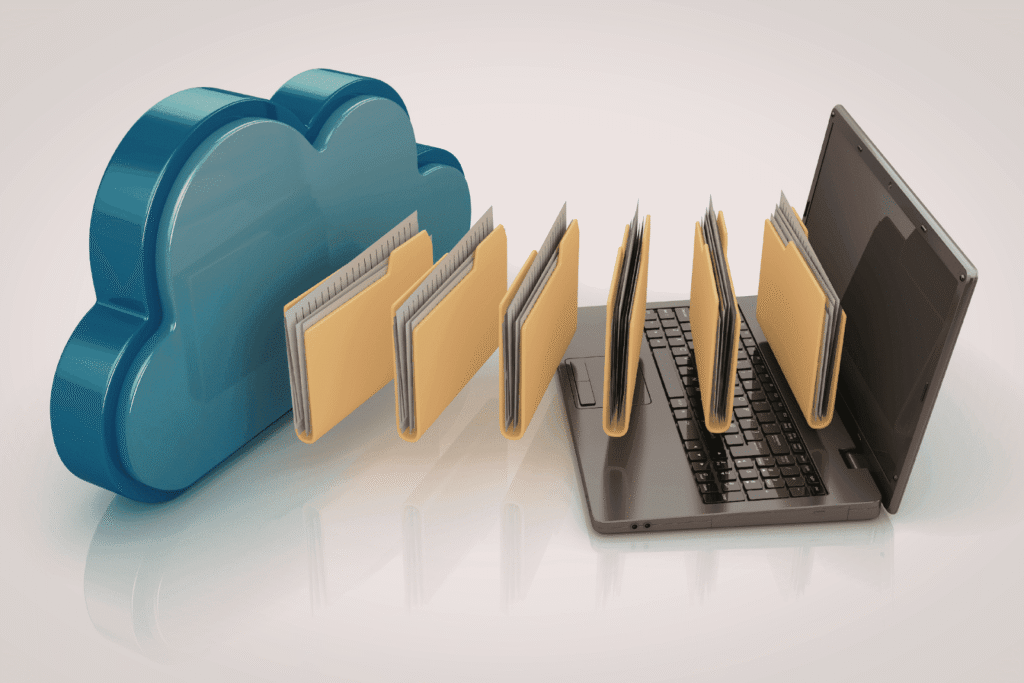 Folders transferring between a laptop and a cloud icon, representing cloud file storage and sync.