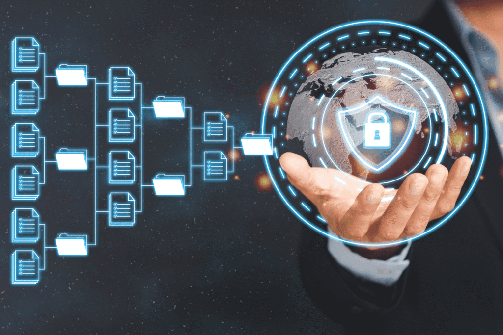 Hand holding a digital globe with a shield and lock icon, representing data security and protection